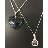 A heart shaped fluorite pendant with 925 silver bale on a 16 inch curb chain.