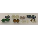 8 pairs of silver and white metal stud style earrings.