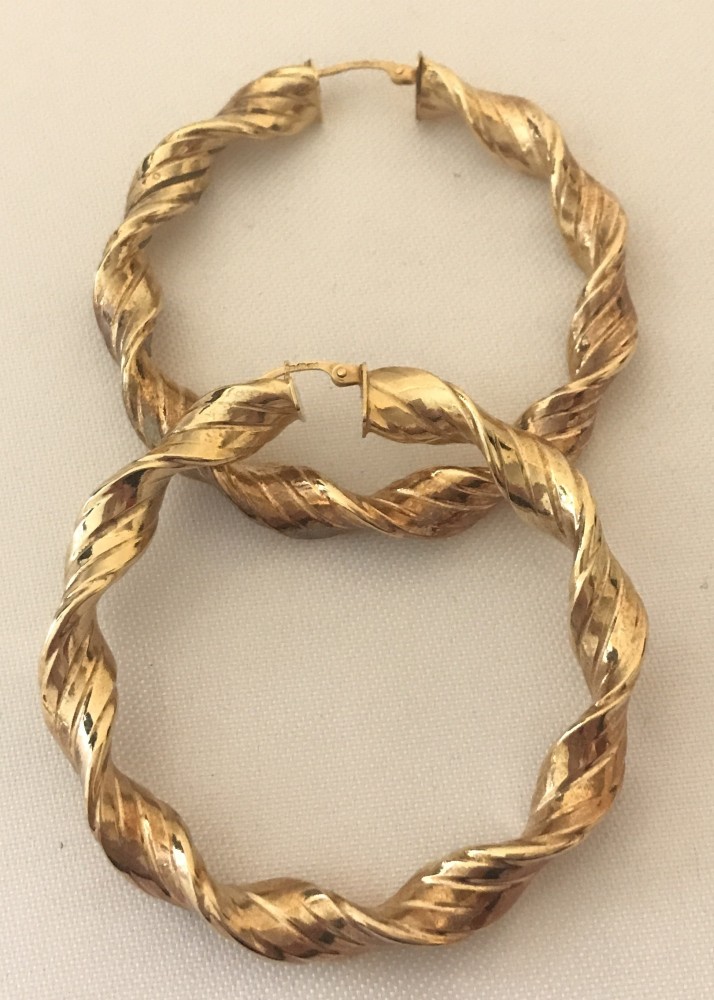 A pair of 9ct gold large twisted hoop earrings.