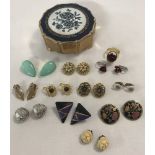 A small vintage Stratton jewellery box containing a quantity of vintage and retro clip on earrings.