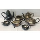 A box of silver plated tea and coffee pots, sugar bowls and milk jugs.