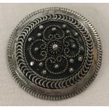 A 925 silver circular shaped brooch.