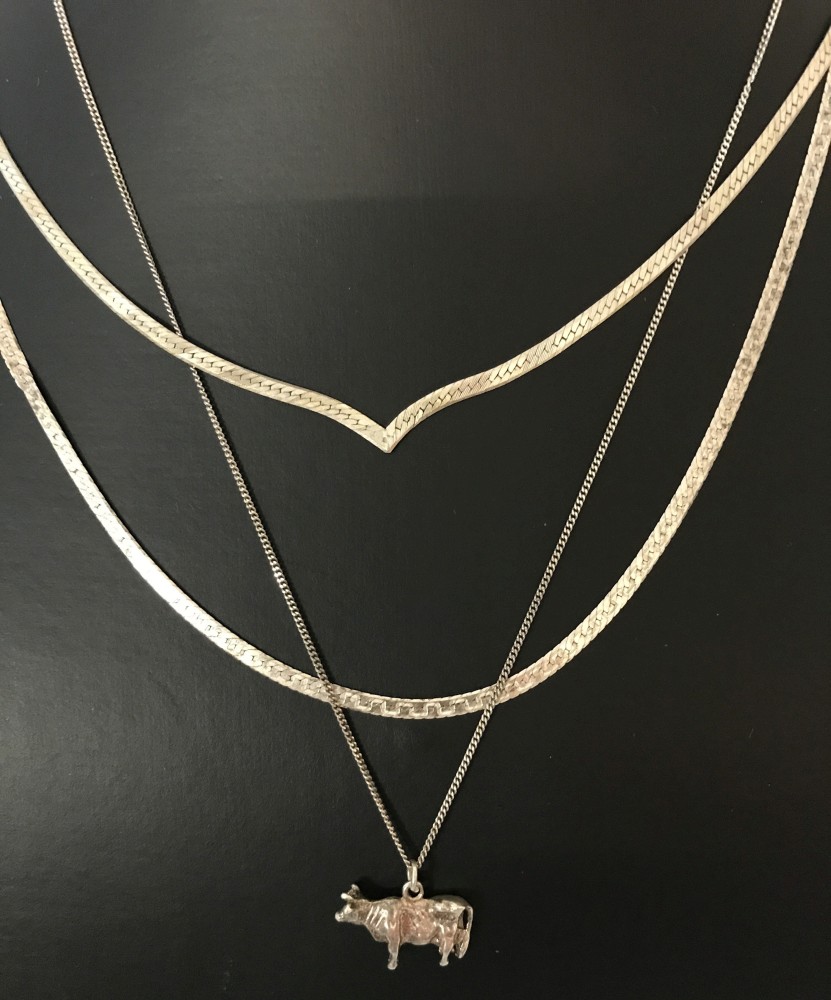 3 silver necklaces.