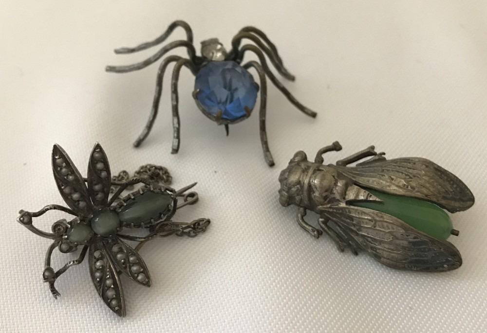 3 vintage bug brooches all with stone set bodies.