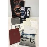 A collection of watch catalogues and magazines.