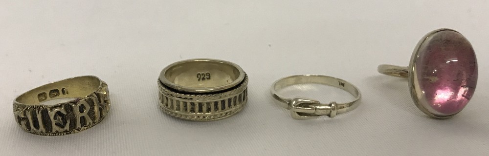 4 silver dress rings.