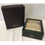 A boxed high lacquer graphite grey watch box with geometric design by Walwood.