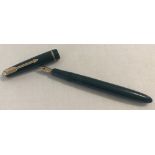 A vintage Parker Slim fold green fountain pen with 14ct gold nib and banding.