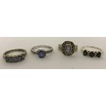 4 ladies stone set silver dress rings.