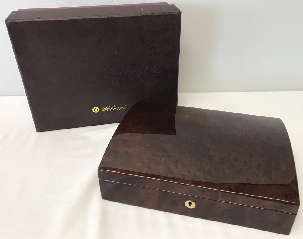 A boxed red Birdseye maple jewellery box by Walwood.