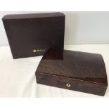 A boxed red Birdseye maple jewellery box by Walwood.