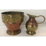 A vintage brass and copper pot with floral design to top rim.