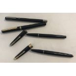 3 Parker fountain pens together with a Osmiroid fountain pen.