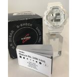 A men's Casio G -Shock Protection wristwatch with white plastic strap.