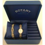 A boxed ladies gold tone wristwatch and bracelet set by Rotary.