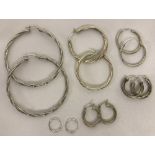 6 pairs of silver hoop earring.