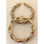 A pair of 9ct gold large twisted hoop earrings.
