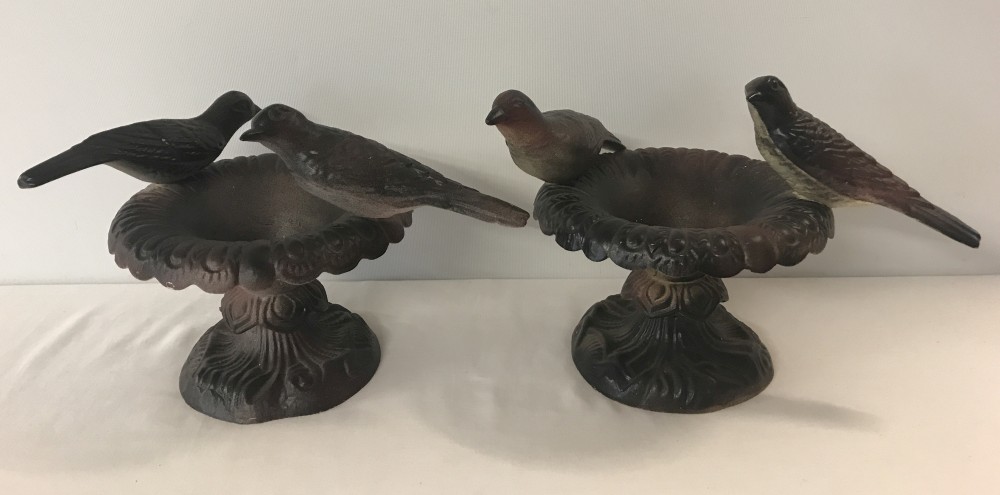 A pair of cast iron candle holders / ornaments.