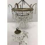 A small vintage decorative glass drop chandelier.