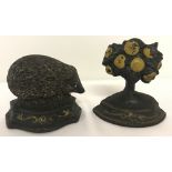 2 small vintage cast iron door stops.