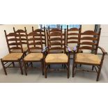 A set of 8 rush seated ladder back farmhouse dining chairs, comprising 6 chairs and 2 carvers.