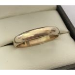 A 9ct gold 4mm thick wedding band.