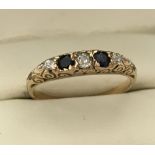 A vintage 18ct gold sapphire and diamond dress ring.