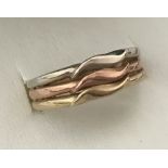 A ladies 14ct tri coloured 3 band gold dress ring.