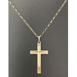 A vintage 9ct gold cross pendant on a 20 inch 9ct gold fine belcher chain.