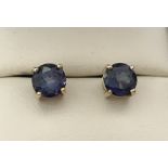 A pair of 9ct gold iolite set stud earrings. Approx. 1ct stones.
