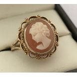 A 9ct gold ladies classic cameo ring in decorative mount.