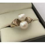 A vintage style double pearl 9ct gold ladies dress ring.