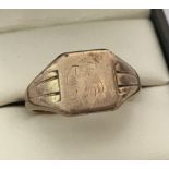 A 9ct gold signet ring with worn initials to cartouche.