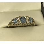 A 9ct gold Blue Topaz and Diamond dress ring.