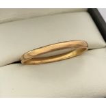 A 22ct gold 2mm wedding band.