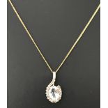 An aquamarine and diamond pendant set in 9ct gold on an 18 inch fine 9ct gold curb chain.