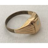 A vintage men's signet ring. Front of ring tests as 14ct gold. Repaired band not gold.