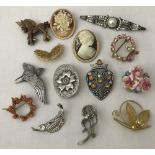 14 vintage brooches, some stone set.