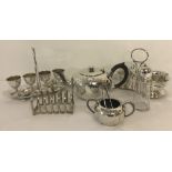 A vintage Art Deco style silver plated boiled egg set with spoons.