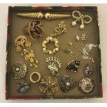 A quantity of vintage brooches, pins, badges and scarf clips.