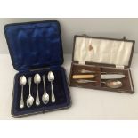 2 vintage cased cutlery sets, one to include silver.