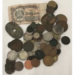 A tin of assorted old British and Foreign coins and a bank note.