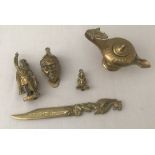 3 brass vintage door knockers together with a dagger letter opener and a genie's lamp.