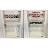 A swivel shop display cabinet with Corgi, Dinky and Matchbox advertising.
