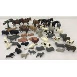 A collection of vintage lead & hollow cast metal farm and farm animal figures.