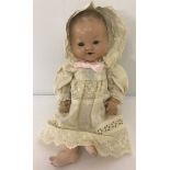 A Germany composition baby doll. Marked 55H 2/0 Germany to back of head.