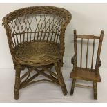 A vintage dolls wicker chair together with a dolls wooden rocking chair.