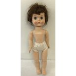 A 1950's hard plastic "Roddy" walker doll with no clothes. Head turning mechanism in good order.