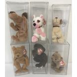 A collection of 6 cased Beanie Babies Characters by TY.