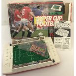 A boxed 1980's Tomy Super Cup Football Electric game in as new condition, box shows signs of wear.